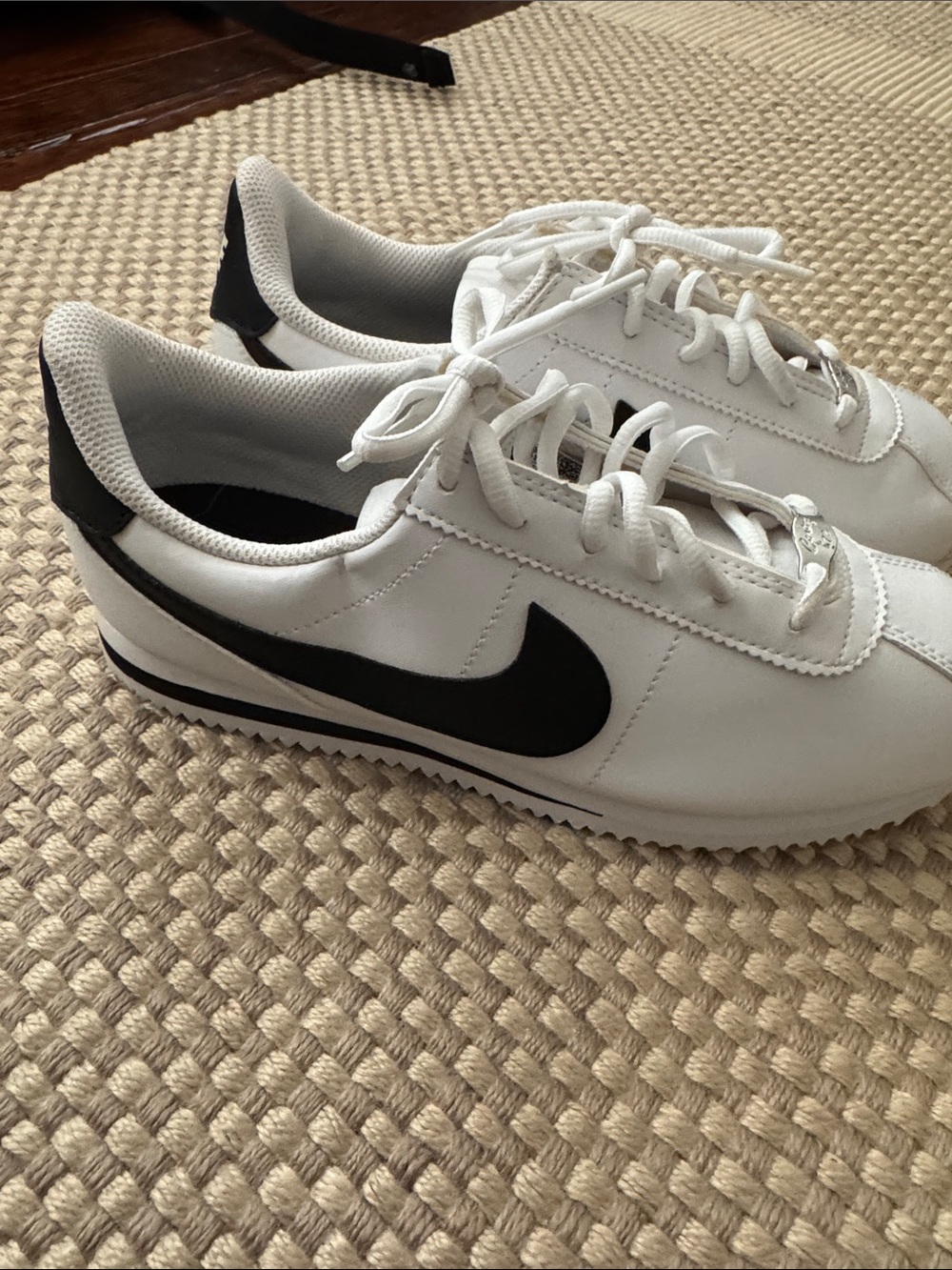 Nike Kids White Sneakers with Black Swoosh